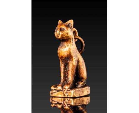 Late Period, Ca. 664 - 332 BC. A gold cat amulet depicting a seated feline with an upright posture, finely modelled with a ro