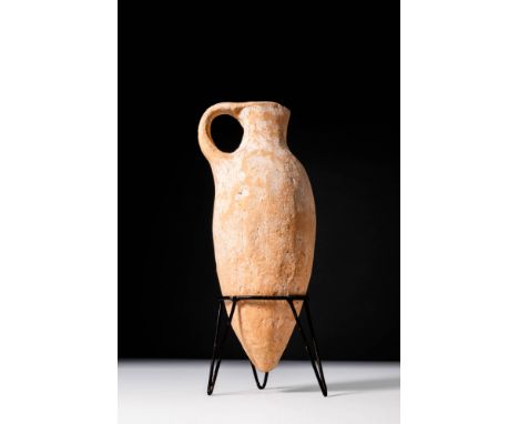 New Kingdom, Ca. 1550 - 1069 BC. An Egyptian pottery vessel with a slender ovoid body tapering to a pointed base. The short n