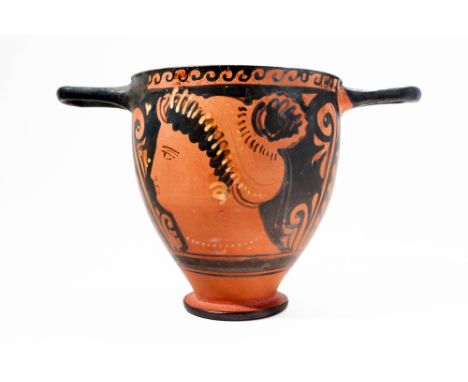 Ca. 350 - 330 BC. A black-glazed pottery skyphos with an inverted bell-shaped body and two horizontal handles. It is decorate
