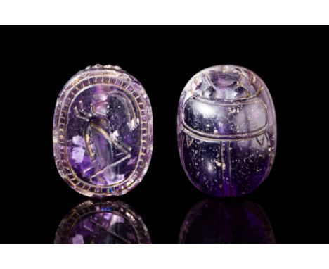 Ca. 450 - 400 BC. An amethyst scarab with a rounded, domed back and incised lines defining the clypeus and elytra. The unders