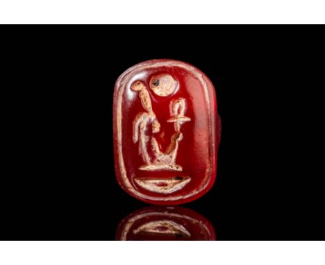 New Kingdom, Ca. 1250 BC. A carnelian seal with an incised cartouche containing the throne name of Pharaoh Amenhotep III, Neb