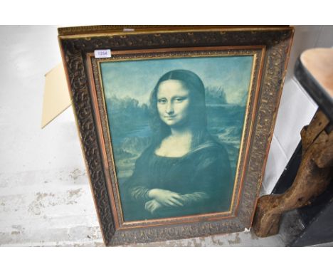A print of the Mona Lisa in gesso frame