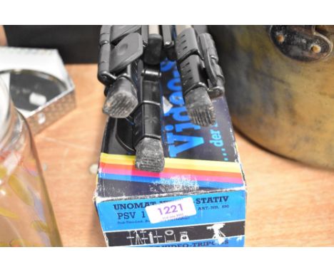A Video recorder tripod in box.