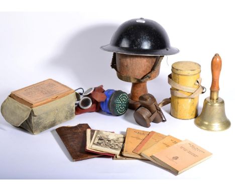 An Assortment of Second World War Memorabilia, including a black-enamelled Brodie helmet, inscribed RP/G to the crown and DC.