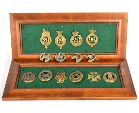 A Collection of Badges, including four brass helmet plate centres, six brass glengarry badges and four white metal Light Infa