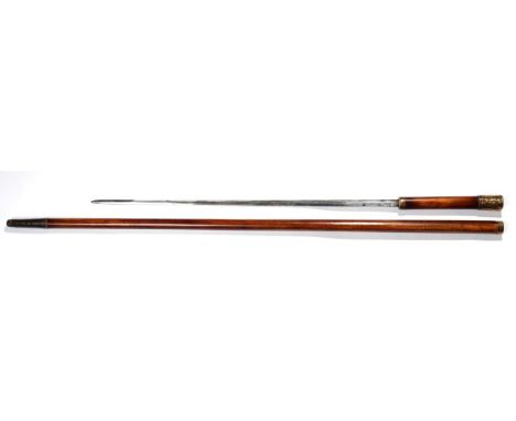A Late 18th Century Malacca Sword Stick, the 55cm single edge steel blade with a narrow fuller to the back edge, with foliate
