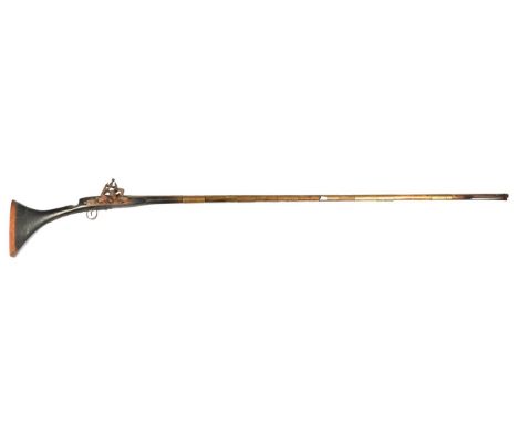 A 19th Century North African Snaphance Longarm, the steel barrel, length 161 cm, with slightly flared muzzle, cast with an in