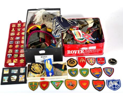 A Miscellaneous Collection of Militaria, including formation badges, rank stripes, US regimental crest enamel badges, reprodu