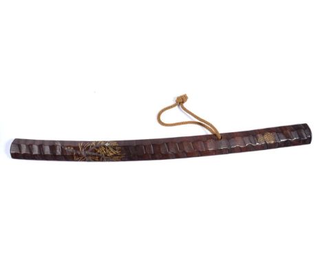 A Japanese Hardwood Swagger Stick, of diagonal rib carved wakizashi shape, decorated with pine branches in gold lacquer and m