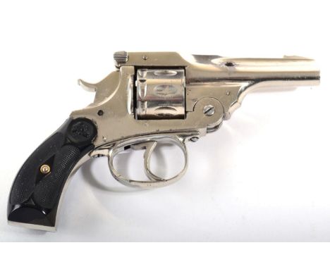 A German Rimfire Blank Firing Eight Shot Revolver, with chromed finish, the frame hinged from the top for loading, the cheque