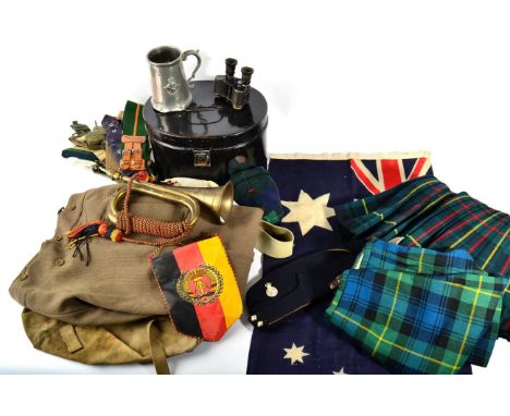 A Quantity of Militaria, including two kilts, wool tartan socks,  canvas stable and other belts a black japanned helmet tin, 