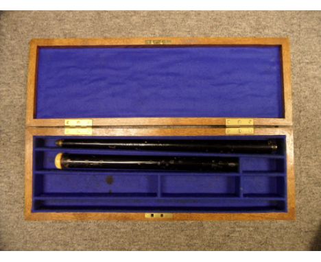 ˜A CASED .42 CALIBRE AIR CANE, LATE 19TH CENTURY with black painted body fitted with button trigger (rifled sleeve, ramrod an