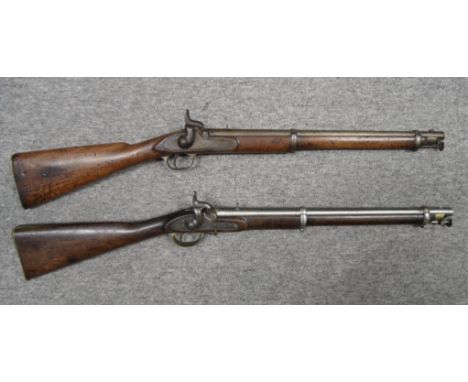 A .650 CALIBRE PERCUSSION CAVALRY CARBINE, DATED 1858 AND ANOTHER, DATED 1864 the first with tapering sighted barrel, standin