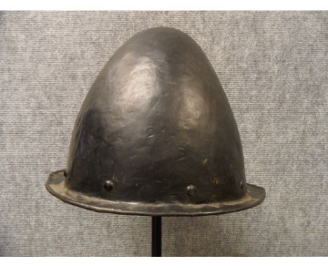 A GERMAN MORION IN THE SPANISH FASHION, CIRCA 1600 with one-piece crown of rounded almond shape and narrow flat integral brim