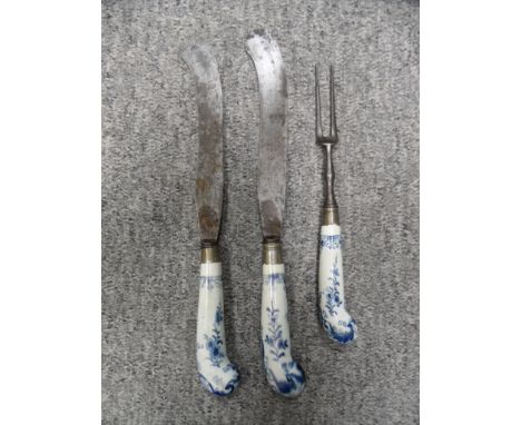TWO KNIVES AND A FORK, CIRCA 1760-70, PROBABLY WORCESTER the two knives with broad flat blades turned up and widening at the 