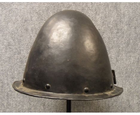 A GERMAN MORION IN THE SPANISH FASHION, CIRCA 1600 with one-piece crown of rounded almond shape and narrow flat integral brim