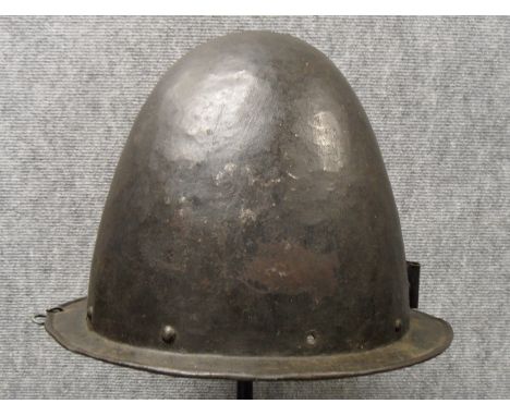 A GERMAN MORION IN THE SPANISH FASHION, CIRCA 1600 with one-piece crown of rounded almond shape and narrow flat integral brim