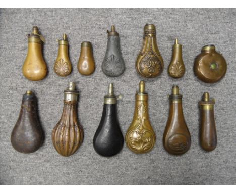 A LARGE COLLECTION OF POWDER AND SHOT-FLASKS, 19TH CENTURY AND LATER the first by Dixon & Sons, with graduated nickel nozzle,