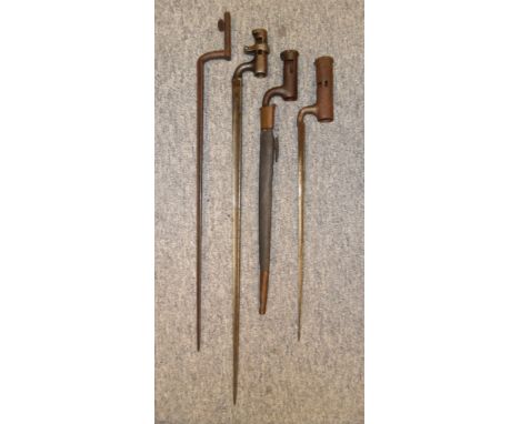 FOUR SOCKET BAYONETS, 19TH CENTURY the first with its scabbard retained by a spring catch; the second with ring locking catch