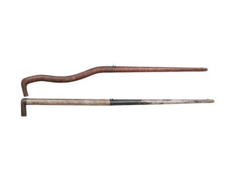 TWO .36 CALIBRE RIFLED AIR CANES the first with brass muzzle cap, button trigger, rotating breech-cover, curved upper portion
