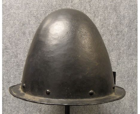 A GERMAN MORION IN THE SPANISH FASHION, CIRCA 1600 with one-piece crown of rounded almond shape and narrow flat integral brim