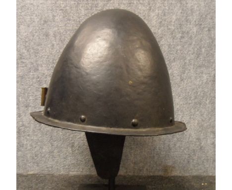 A GERMAN MORION IN THE SPANISH FASHION, CIRCA 1600 with one-piece crown of rounded almond shape and narrow flat integral brim