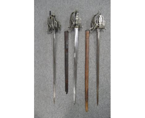 THREE HIGHLAND BASKET-HILTED BROADSWORDS, LATE 19TH/20TH CENTURIES the first with broad fullered blade by Mole of Birmingham,