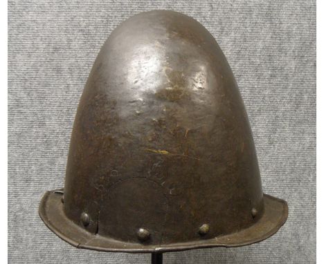 A GERMAN MORION IN THE SPANISH FASHION, CIRCA 1600 with one-piece crown of rounded almond shape and narrow flat integral brim