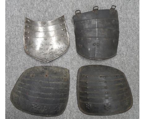 TWO NORTH EUROPEAN PIKEMAN'S TASSETS, ALMOST FORMING A PAIR, PROBABLY GERMAN, CIRCA 1630-40; A GERMAN LIGHT FIELD TASSET FOR 
