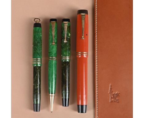 A PARKER DUOFOLD  ORANGE FOUNTAIN PENCap and Barrel: Orange cap and barrel, the cap with gilt clip and double cap band Nib an
