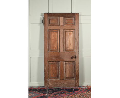 A GEORGE III MAHOGANY SIX PANEL DOOR  LATE 18TH CENTURY  197cm high, 91cm wide This door came from The Charlton House Hotel (