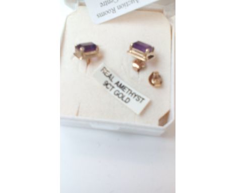 Pair of 9 carat gold earrings set with amethyst  