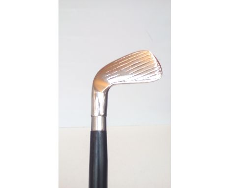 Walking stick with stylised golf club handle 