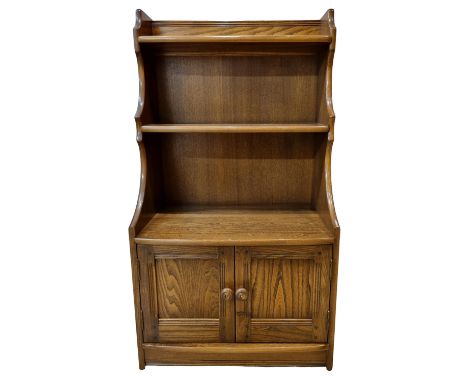 Mid Century Ercol Waterfall Bookcase with Lower Cupboard, In Elm, Old Colonial Design. The Whole unit has been well looked af