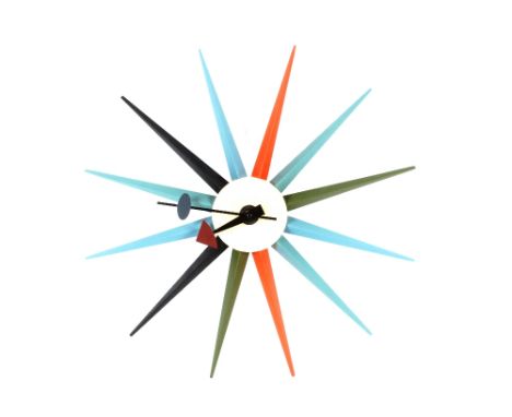A multi-coloured battery powered sunburst clock