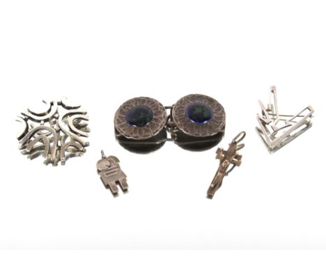 A Norwegian silver modernist brooch; an English Hallmarked silver similar; a Guild of Handicrafts design pewter and enamel bu