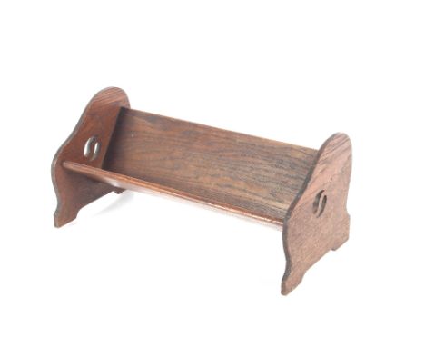 An Art Deco design oak book trough, 41cm wide 
