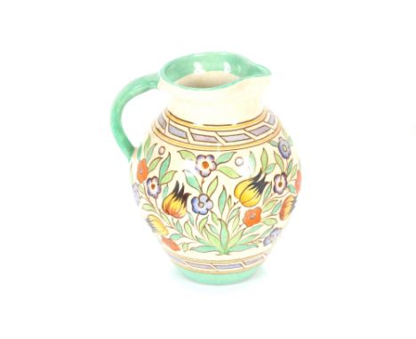 A Charlotte Rhead Bursley ware jug with tube lined floral decoration, numbered TL14, impress No.673, 21cm high 