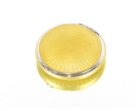 An Art Deco silver and yellow enamel compact, London 1930, 5.5cm diameter&nbsp;