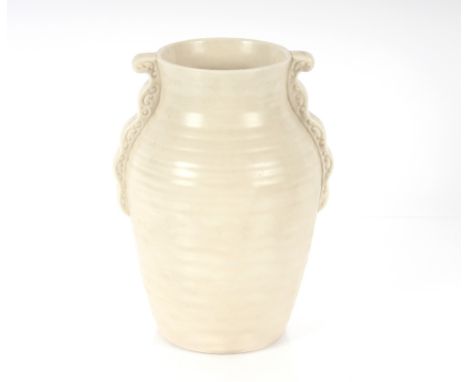 A Clarice Cliff cream coloured vase, with ribbed body and scroll applied handles, 26cm high 