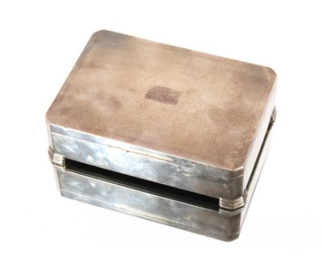 A silver cigarette box, of Art Deco design, wooden two compartment interior, the lid with engine turned decoration, Birmingha