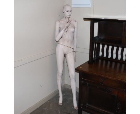 A female shop mannequin, 177cm high 