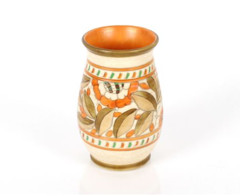 A Charlotte Rhead Crown Ducal vase with tube lined floral decoration, signed to base, impress No.133, 17cm high 