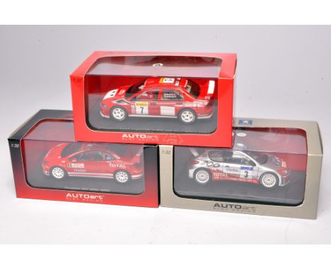 Autoart slot car issues comprising Peugeot 206 WRC, Mitsubishi Lancer Evolution and Peugeot 307 WRC . All appear without faul