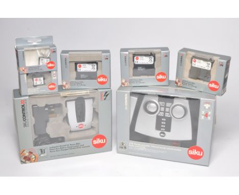 Siku 1/32 farm model accessories to include Control Series 6707 BS Power Battery Charger and power pack, 6701 Infrared remote