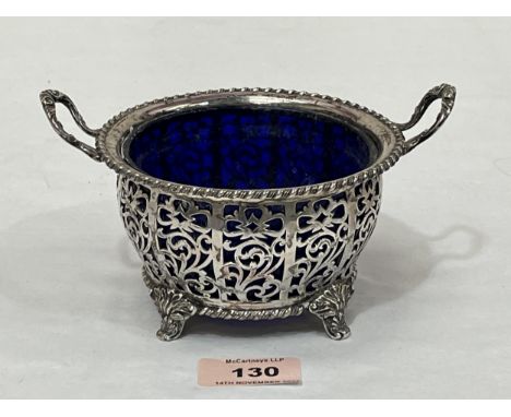 A George V silver reticulated sucrier by Walker and Hall, with blue glass liner. Sheffield 1927. 6¼" diam over handle. 6ozs 1