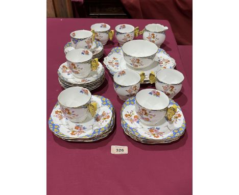 A Royal Albert Florette pattern part tea service to comprise eight cups, eleven saucers, two sandwich plates, milk jug (damag