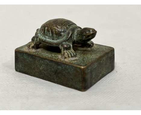 A Chinese bronze turtle seal. 1¼" long.