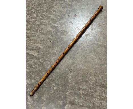 A Chinese bamboo flute stick. 40" long.