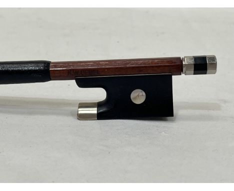 A violin bow signed K W Uebel.